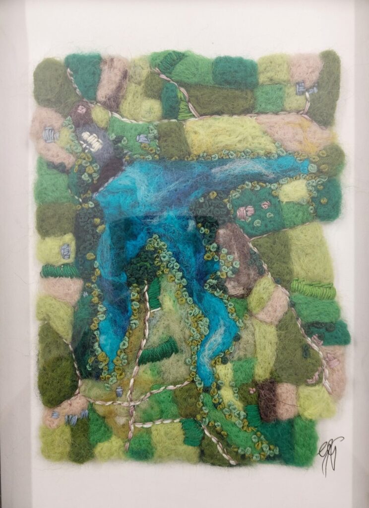 a fabulous needle felted picture of Guernsey's reservoir from above by Gerie Green, with lots of greens and blues.