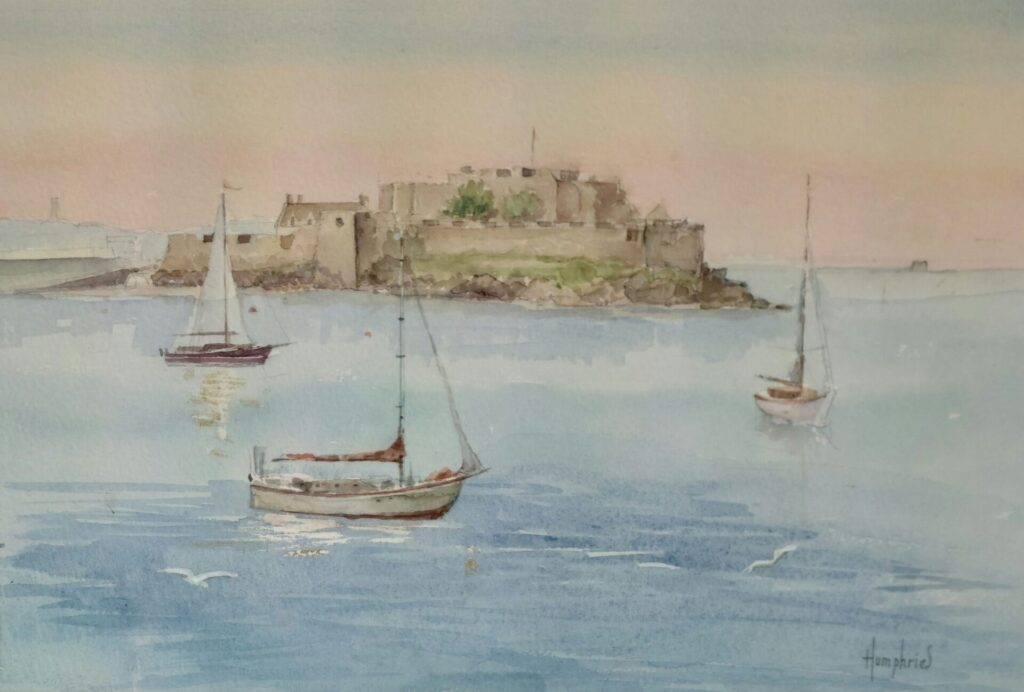 a gentle watercolour painting of Castle Cornet in Guernsey. Painted from Havelet Bay with 3 sailing boats anchored at sea in the foreground.