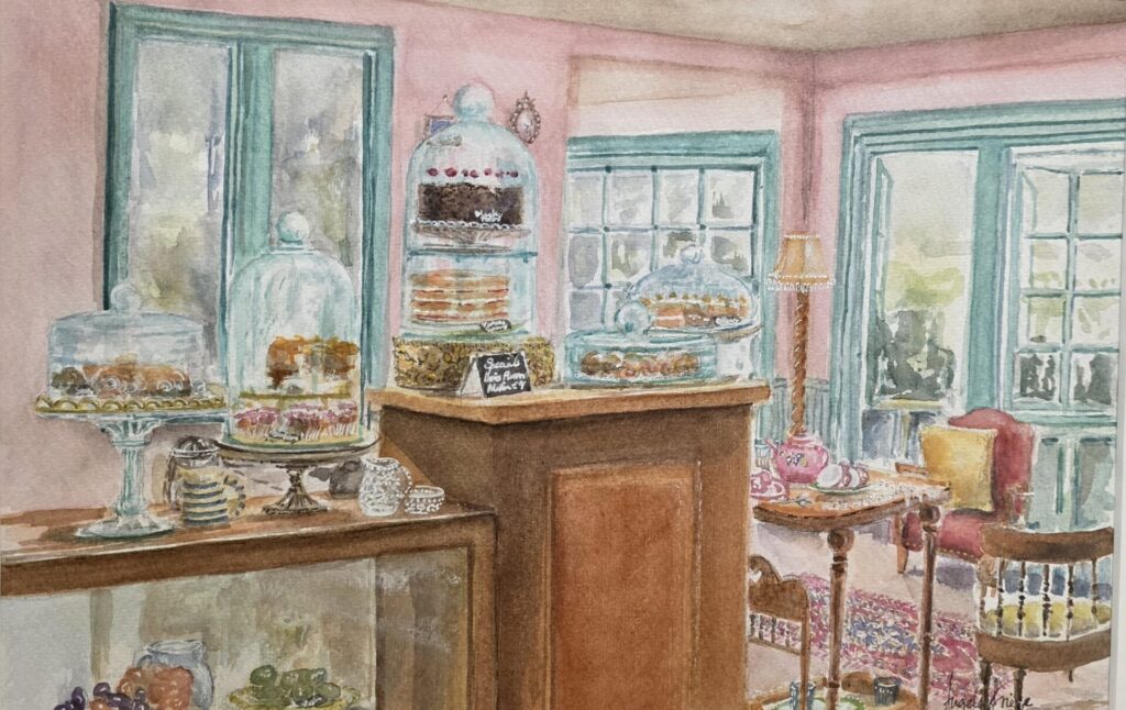 The Cake Room Watercolour painting titled ‘The Cake Room’ by Angela Grieve, featuring pastel pink walls, turquoise window and door frames, and a colourful display of cakes. Framed, 340x440mm, available for £99.